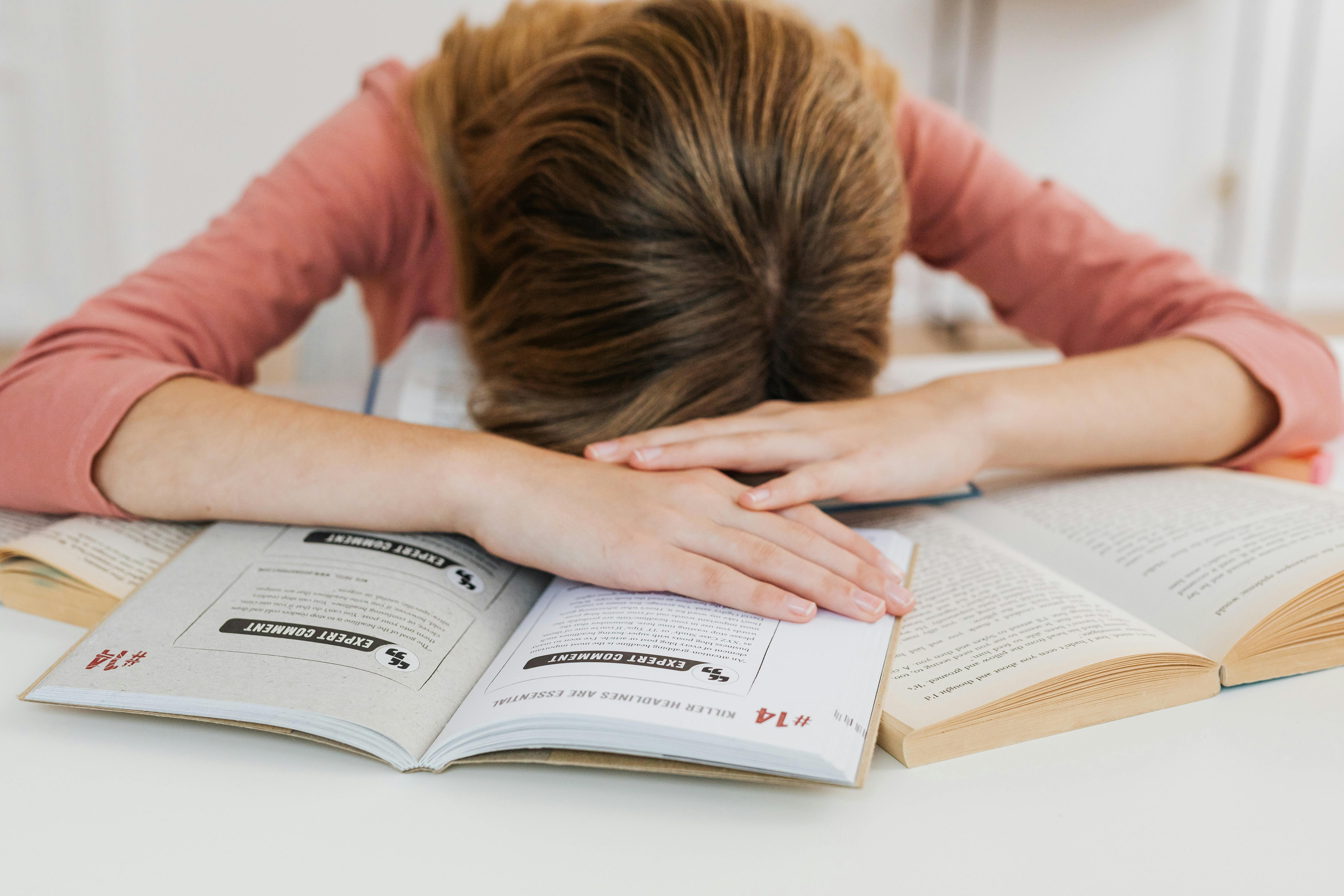 Woman experiencing fatigue and low energy sitting on couch